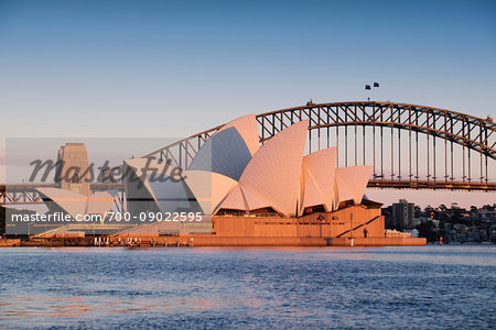 Sydney Opera House and the Sydney Harbour Bridge at sunrise in Sydney, Australia