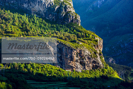 Mountain side with home under the cliffs in Torla-Ordesa in Ordesa y Monte Perdido National Park in the Pyrenees in Huesca Province in Aragon, Spain