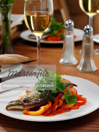 Sea bass in a restaurant table setting