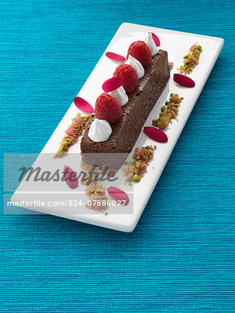 A whole chocolate marquis with raspberries and cream gourmet dessert