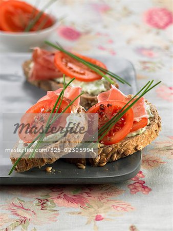 brousse cheese, raw ham and tomato open sandwiches