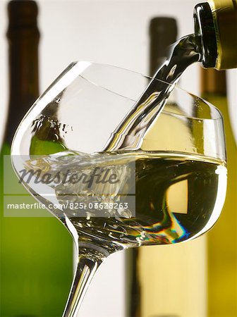 Pouring a glass of white wine