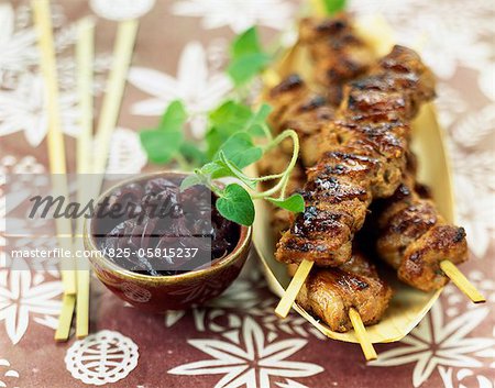 Satay-style pork kebabs grilled on the barbecue