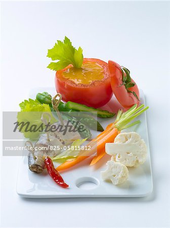 Sardines and raw vegetables with tomato dip