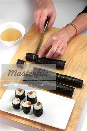 Cutting the rolls into makis