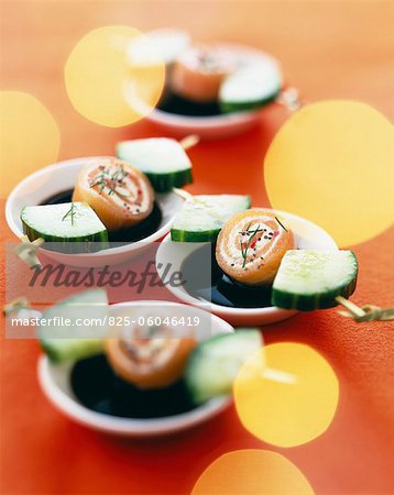 Smoked salmon and cream cheese rolls with cucumber mini brochettes