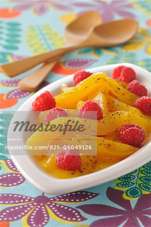 Stewed mangoes with fresh raspberries ,honey and vanilla