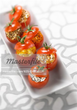 Cherry tomatoes stuffed with spicy goat's cheese