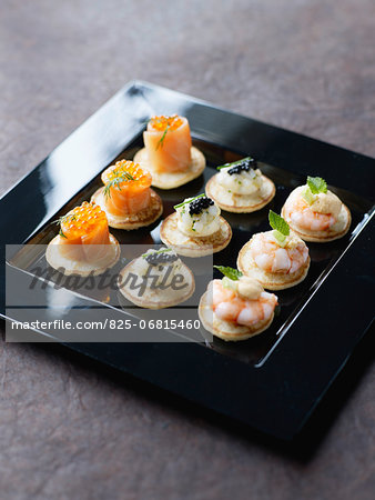 Tray of mini blinis for a cocktail by Dalloyau