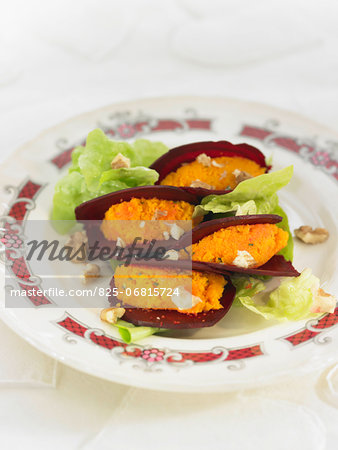 Sliced beetroots stuffed with carrot puree and walnuts