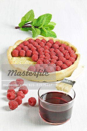 Preparing a raspberry tart