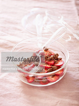 Strawberry fruit salad with crumbled chocolate cookies