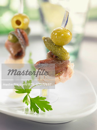 Anchovy,tuna,gherkin and green olive mini brochettes