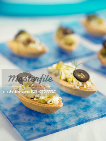 Anchocy,black pepper,egg and gherkin canapés