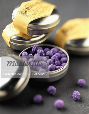 Small tins of crystallized violet candies