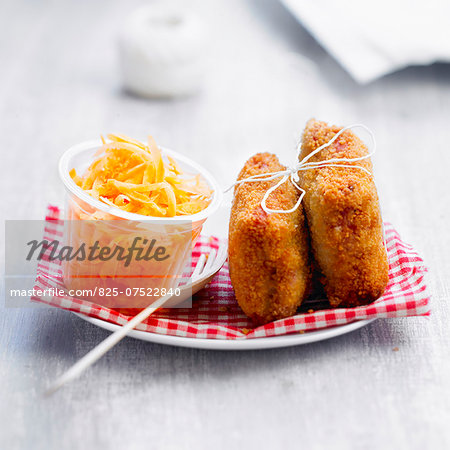 Breaded ham and mash bites with grated carrots