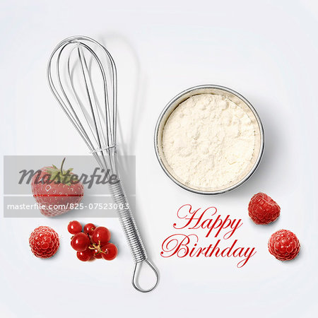 Flour and whisk for a birthday cake