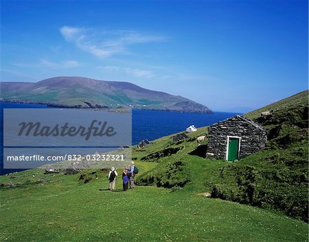High angle view of tourists standing near a lake, Blaskets Islands, Dingle Peninsula, Republic Of Ireland