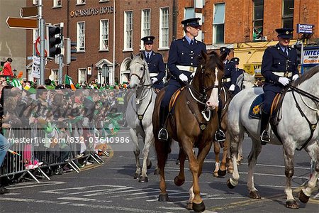 Dublin, Ireland; Police Riding Horses As Part Of A Parade Going Down O'connell Street