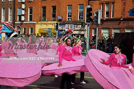 Dublin, Ireland; People In Costumes Dancing On O'connell Street As Part Of A Parade