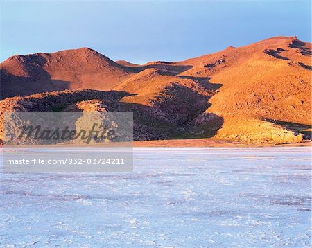 Uyuni salt flat and hills at sunrise