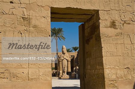 Looking through doorway of Temple of Ramses III to Colossus of Ramses II