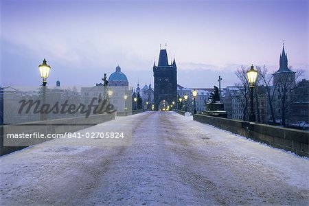 Charles Bridge in winter snow, Prague, UNESCO World Heritage Site, Czech Republic, Europe Charles Bridge in winter snow, Prague, UNESCO World Heritage Site, Czech Republic, Europe