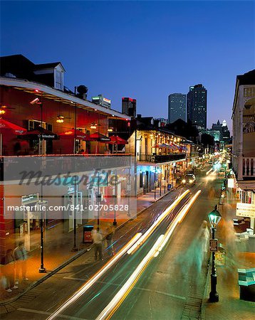 Bourbon Street and city skyline at night, New Orleans, Louisiana, United States of America, North America