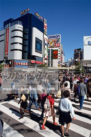 People on road crossing in Shibuya-Ku area, Tokyo, Japan, Asia