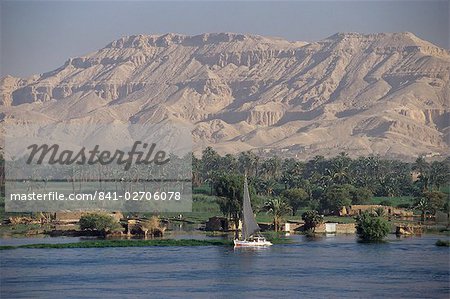 Felucca on the River Nile, looking towards Valley of the Kings, Luxor, Thebes, Egypt, North Africa, Africa