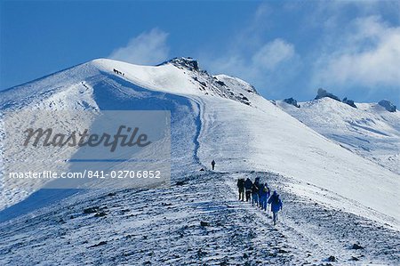 Hikers on rim of old crater, Avacha volcano, Kamchatka, East Siberia, Russia