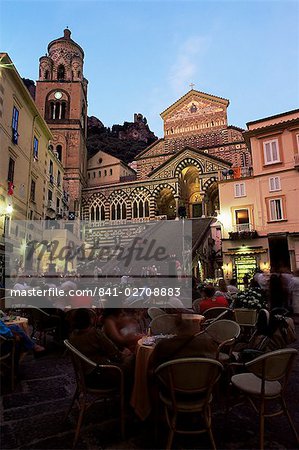 Busy pavement cafe at dusk, with the cathedral beyond, Amalfi, Costiera Amalfitana, UNESCO World Heritage Site, Campania, Italy, Europe