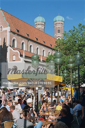 Street scene with pavement cafe and church in the pedestrian zone on Neuhauser Strasse, in Munich, Bavaria, Germany, Europe