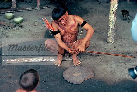 Yanomami man preparing hallucinogenic snuff, Brazil, South America