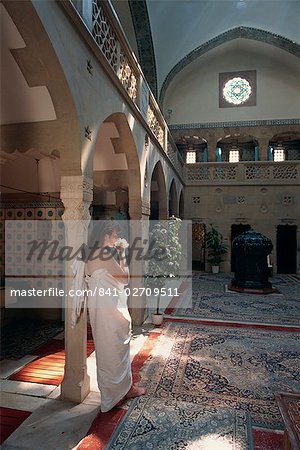 Woman drinking water in the Moorish bath house in the spa at Trenciaske Teplice, Slovakia, Europe