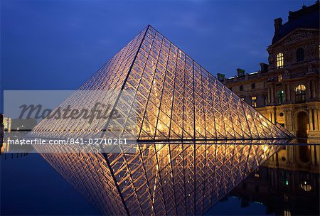 The Pyramide and Palais du Louvre, Musee du Louvre, illuminated at dusk, Paris, France, Europe