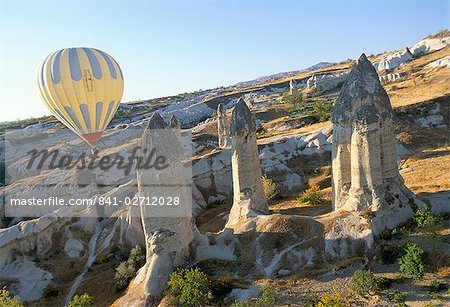 Hot air ballooning over rock formations, Cappadocia, Anatolia, Turkey, Asia Minor, Asia