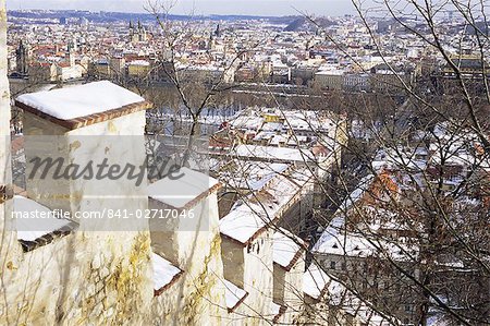 View of city from snow covered Gothic Hunger Wall on Petrin Hill, Mala Strana, Prague, Czech Republic, Europe View of city from snow covered Gothic Hunger Wall on Petrin Hill, Mala Strana, Prague, Czech Republic, Europe