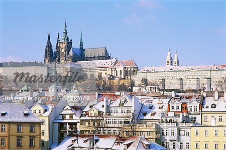 Prague Castle and houses of Mala Strana suburb in winter, Prague, Czech Republic, Europe Prague Castle and houses of Mala Strana suburb in winter, Prague, Czech Republic, Europe