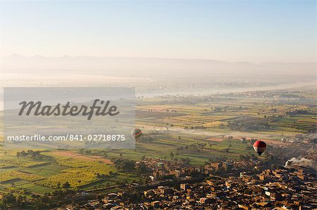 Hot air balloons over the West Bank (Western Thebes), Thebes, Egypt, North Africa, Africa