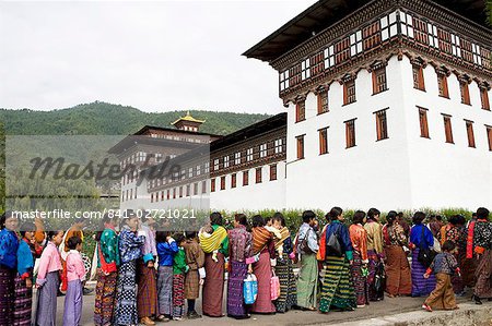 Women entering temple for Buddhist festival (Tsechu), Trashi Chhoe Dzong, Thimphu, Bhutan, Asia
