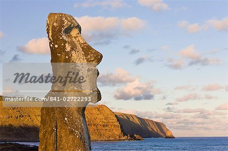 Lone monolithic giant stone Moai statue looking out to sea at Tongariki, Rapa Nui (Easter Island), UNESCO World Heritage Site, Chile, South America
