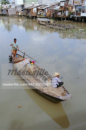 Boat on the Kinh Ben Nghe, a tributary of the Saigon River, in downtown Ho Chi Minh City (formerly Saigon), Vietnam, Indochina, Southeast Asia, Asia
