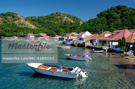 Boats moored behind houses built on the beach of a bay, Terre de Haut, Guadeloupe, Leeward Islands, West Indies, Caribbean, Central America