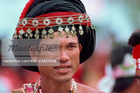 Head and shoulders portrait of a man of the Hwalien tribe during harvest festival in August-September in Taiwan, Asia