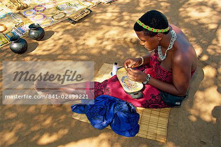 Zulu girl making necklaces, South Africa, Africa