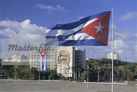 Cuban flag flying outside the Ministerio del Interior, Plaza de la Revolucion, Havana, Cuba, West Indies, Central America