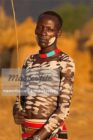 Karo man with body painting, made from mixing animal pigments with clay, at dancing performance, Kolcho village, Lower Omo valley, Ethiopia, Africa