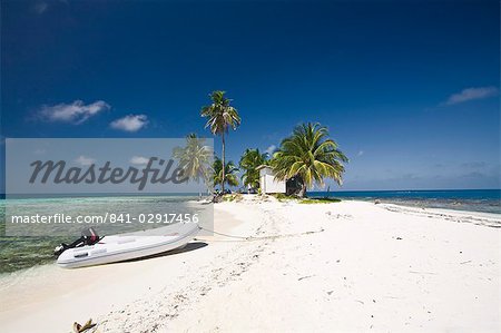 Dinghy on beach, Silk Caye, Belize, Central America