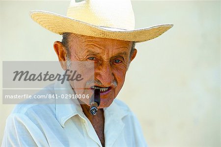 Portrait of a man with a Cuban cigar, Trinidad, Sancti Spiritus province, Cuba, West Indies, Central America